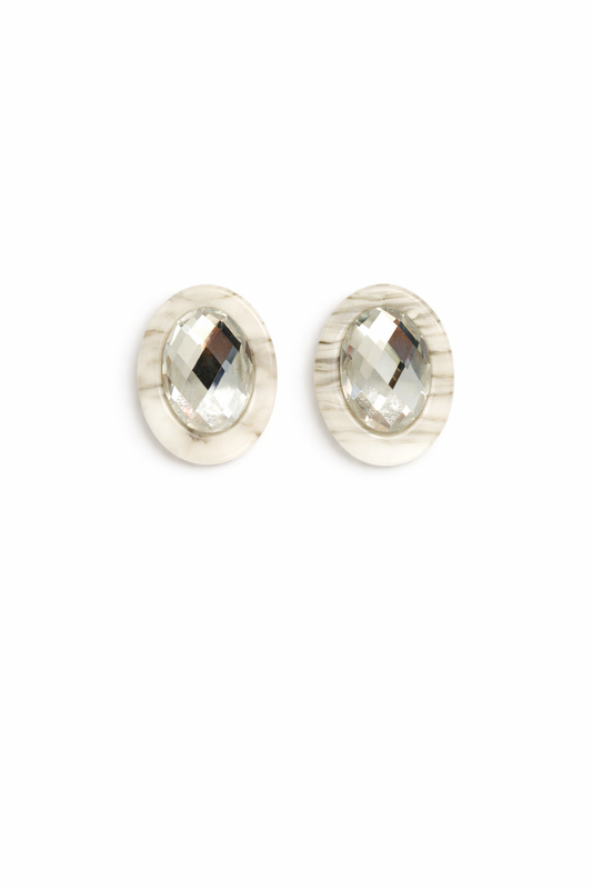 Pair of silver stud earrings on a white background