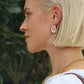 Rhinestone Pink Statement Earring on a womans ear