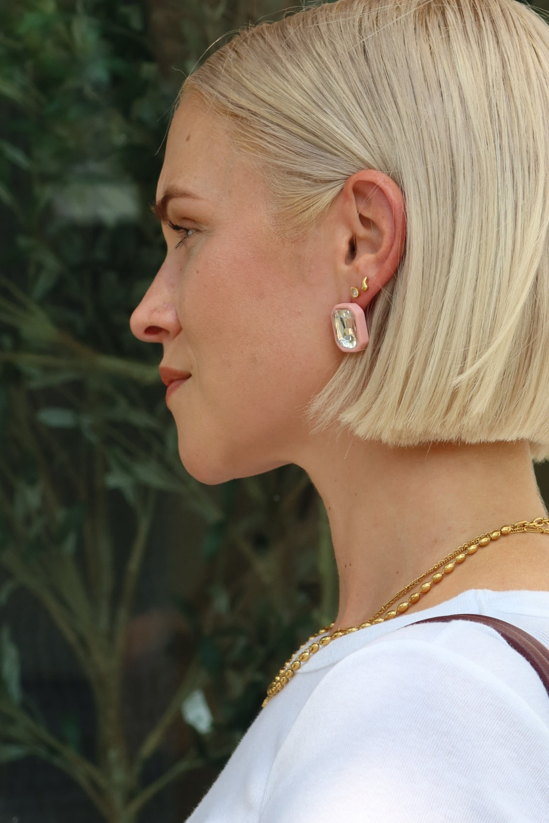 Rhinestone Pink Statement Earring on a womans ear