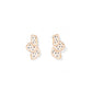 Pair of gold earrings with black polka dots on a white background
