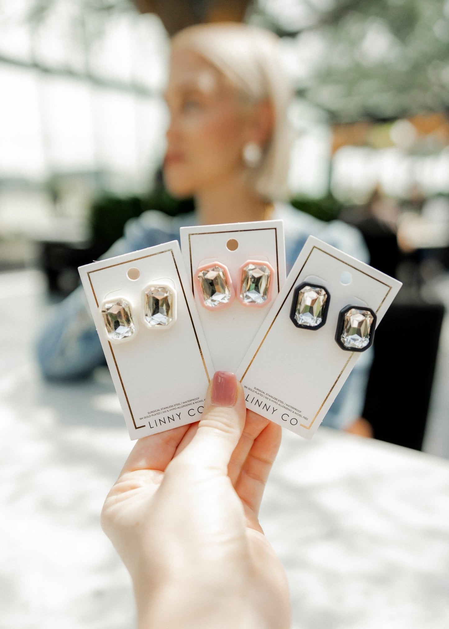 Linny Co Rhinestone Pink Statement Earring on a womans ear in Dallas TX on knox henderson