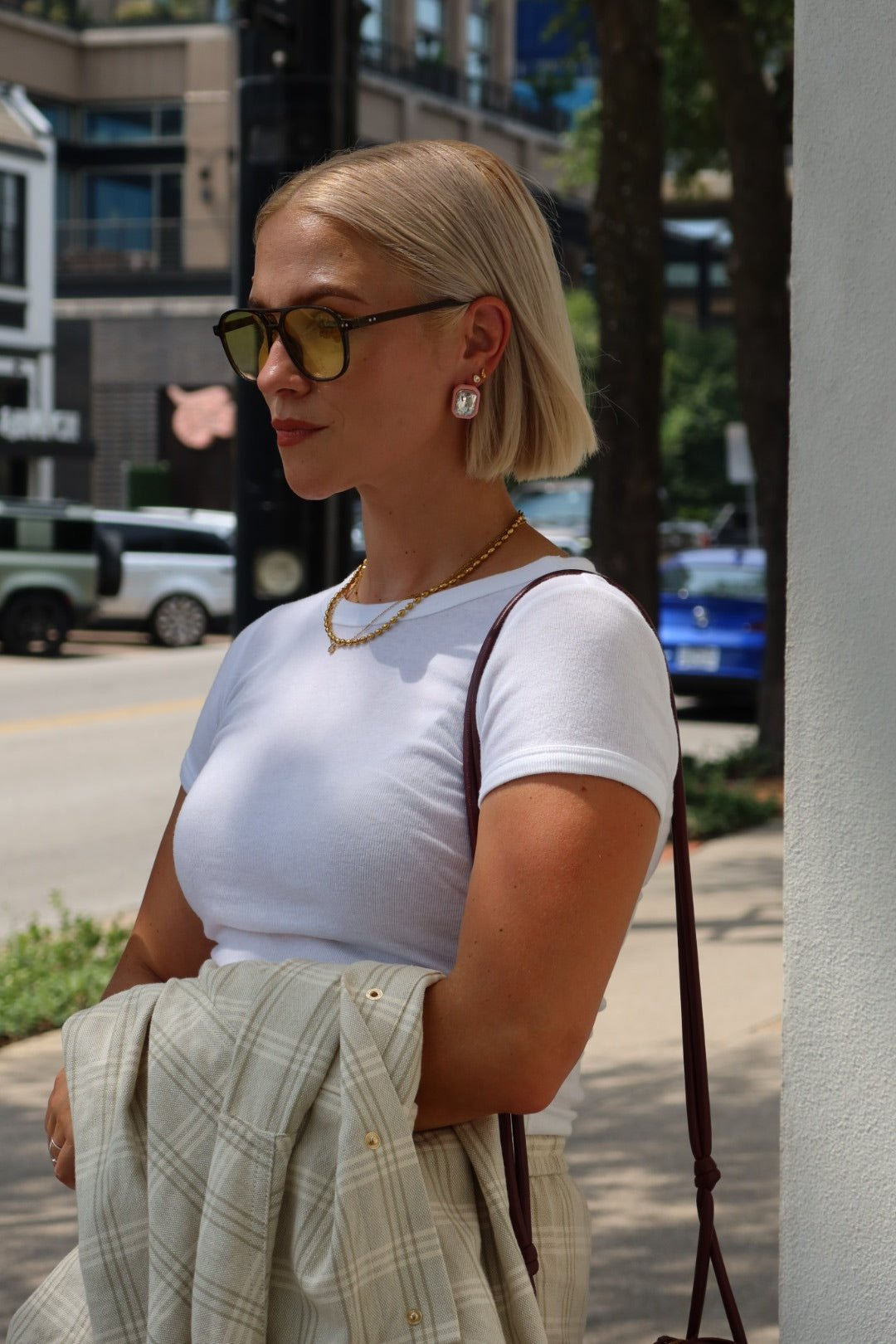 Rhinestone Pink Statement Earring on a womans ear in Dallas TX on knox henderson