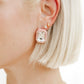 Rhinestone Pink Statement Earring on a womans ear