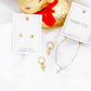 Huggie Charm Earrings - Esther Cross Clear - Shop LINNY CO
